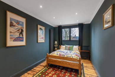 Master bedroom in London with blue walls.