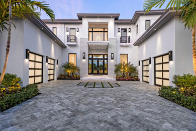 This is an example of a beach style entryway in Miami.