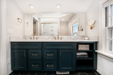 Bathroom - mid-sized modern master white tile porcelain tile, black floor and double-sink bathroom idea in Milwaukee with shaker cabinets, green cabinets, a two-piece toilet, white walls, an undermount sink, quartzite countertops, white countertops and a built-in vanity