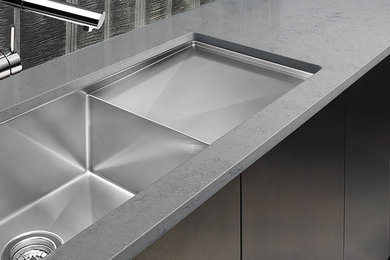 Kitchen - kitchen idea in Ottawa with a double-bowl sink and stainless steel cabinets