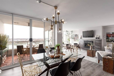 Inspiration for a mid-sized industrial medium tone wood floor and beige floor great room remodel in Vancouver with white walls and no fireplace