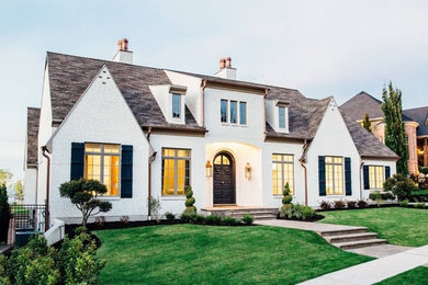 Large transitional white two-story brick gable roof photo in Salt Lake City