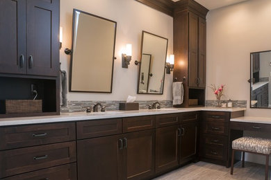 Inspiration for a large transitional master gray tile and glass tile porcelain tile freestanding bathtub remodel in Kansas City with an undermount sink, shaker cabinets, dark wood cabinets, quartz countertops and gray walls