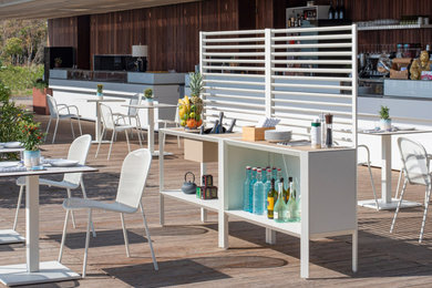 Contemporary back patio in London with an outdoor kitchen.