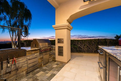 Backyard stone patio photo in Phoenix