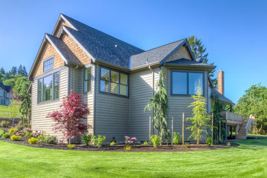 Contemporary beige one-story mixed siding exterior home idea in Portland