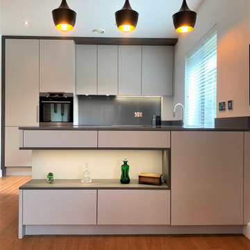 linear lines modern city apartment peninsular layout kitchen