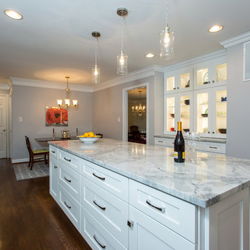 Bright White Kitchen Remodel with Quartz Island and Hardwood Floors