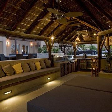 Thatch & timber is the is the focal point of this beautifully landscaped garden