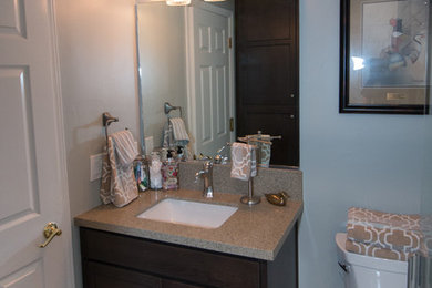 Small elegant 3/4 beige tile and porcelain tile porcelain tile and beige floor bathroom photo in Other with recessed-panel cabinets, gray cabinets, a two-piece toilet, green walls, an undermount sink, quartz countertops and green countertops