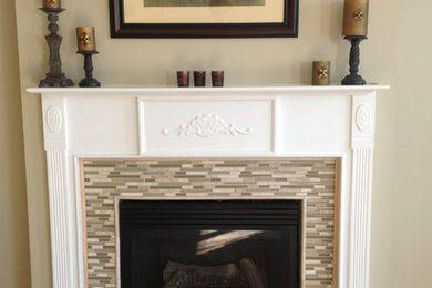 Wood-look tile on the floor and glass mosaic on fireplace