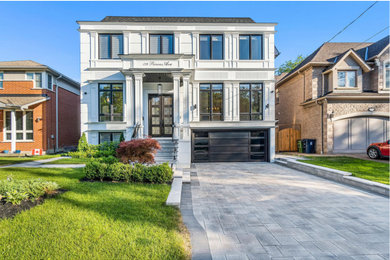 Example of a transitional exterior home design in Toronto