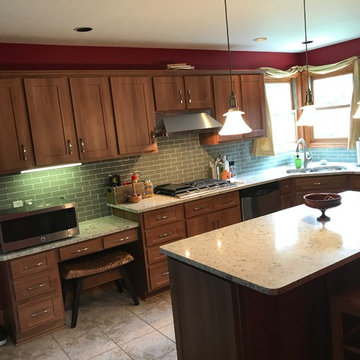 cabinet refacing--med maple with quartz countertops and glass backsplash