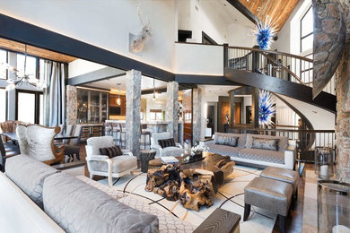 Living room - mid-sized contemporary open concept dark wood floor and brown floor living room idea in Other with white walls, a standard fireplace, a stone fireplace and a concealed tv