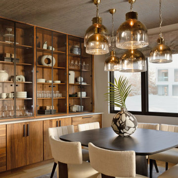 Dining Room Design with Wallpapered Ceiling, Clustered Pendant Lights, and Glass