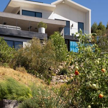 A little farm below a hillside resort-style off-the-grid view home