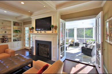Inspiration for a large transitional open concept medium tone wood floor and brown floor living room remodel in Salt Lake City with brown walls, a standard fireplace, a metal fireplace and a wall-mounted tv