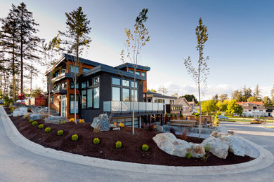 Modern black mixed siding exterior home idea in Vancouver