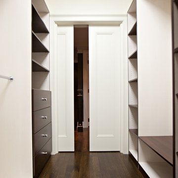 Lots of space for your shoe collection in this walk in closet