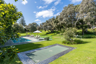 Contemporary front yard outdoor sport court in Melbourne.