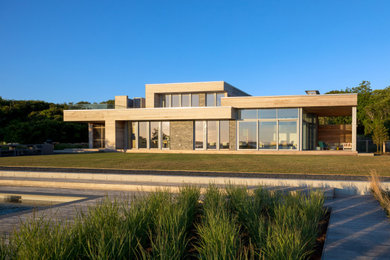 Inspiration for a huge contemporary gray two-story mixed siding exterior home remodel in Boston with a shingle roof