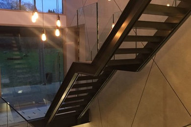 Steel Stairs with frameless glass balustrade