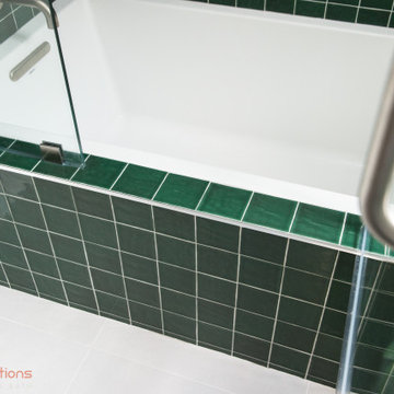 Vibrant Green Ceramic Tiles Bring Life to a Hallway Bathroom