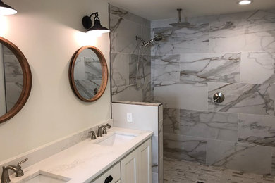 Example of a large minimalist master gray tile, white tile and marble tile marble floor and gray floor bathroom design in Other with shaker cabinets, white cabinets, white walls, an undermount sink, marble countertops and white countertops