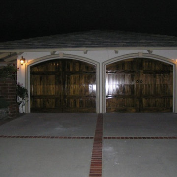 Arched Mahogony Stained Garage Doors
