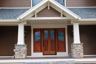 Large arts and crafts entryway photo in San Francisco with a medium wood front door