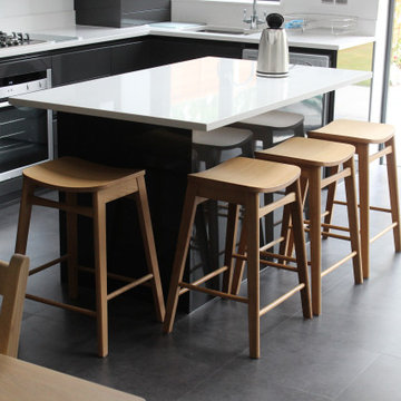 Sleek Modern Black Kitchen with Island by Kudos Interior Design