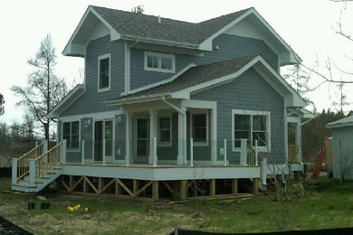Example of a country exterior home design in Grand Rapids