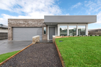 This is an example of a contemporary exterior in Canberra - Queanbeyan.