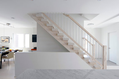 Example of a mid-sized danish wooden straight open and mixed material railing staircase design in Ottawa