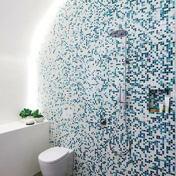 Modern white and green bathroom with custom mosaic gradient
