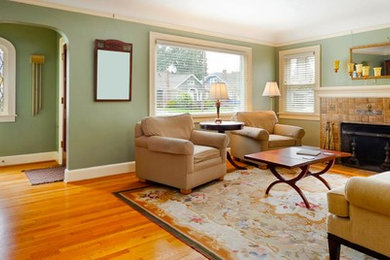 Inspiration for a mid-sized transitional open concept and formal light wood floor and beige floor living room remodel in New York with green walls, a standard fireplace, a tile fireplace and no tv
