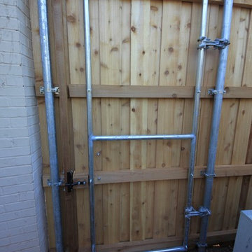 Bowie St - Cedar Fence & Concrete Retaining Wall - Wolflin