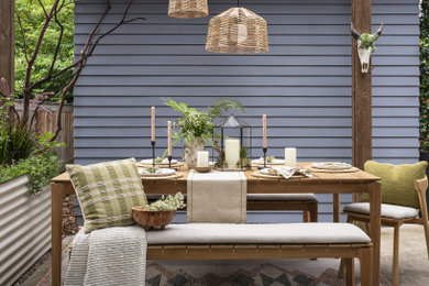 Patio - small transitional backyard concrete patio idea in Portland with a pergola