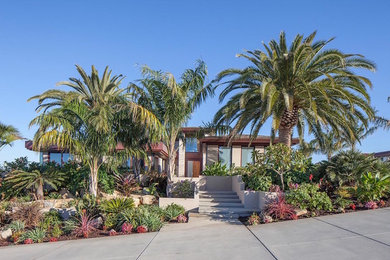Large contemporary beige two-story mixed siding exterior home idea in San Diego