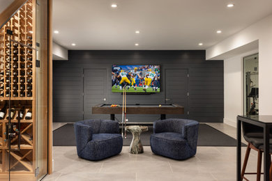 Mid-sized trendy enclosed marble floor game room photo in New York with beige walls, no fireplace and a wall-mounted tv