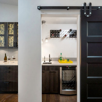 Home Bar Room with wine fridge and wine wall display