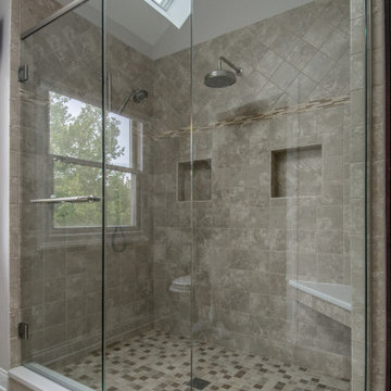 Full Length Glass Walls with Dual Rain Shower Fixtures and Built-In Shower Bench