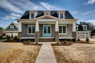 Example of a mid-sized arts and crafts gray two-story concrete gable roof design in Richmond