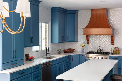 Example of a large transitional l-shaped laminate floor kitchen pantry design in Atlanta with an undermount sink, shaker cabinets, blue cabinets, quartz countertops, white backsplash, ceramic backsplash, stainless steel appliances, an island and white countertops