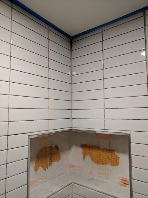 Corner grout line widining as approaches ceiling. Advice Needed!