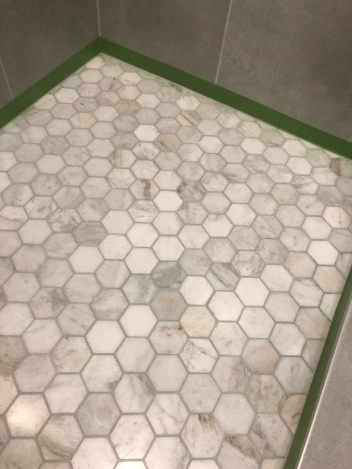 Discolored marble shower floor