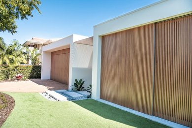 This is an example of a contemporary garage in Sunshine Coast.