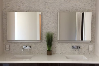 Inspiration for a mid-sized contemporary master white tile and mosaic tile ceramic tile bathroom remodel in San Francisco with flat-panel cabinets, dark wood cabinets, a two-piece toilet, white walls, an undermount sink and quartz countertops
