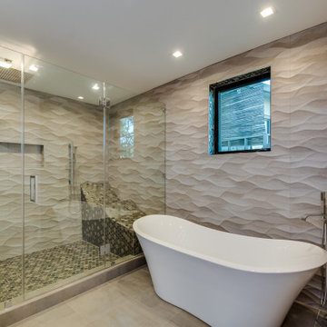 Freestanding Slipper Tub Against Dimensional Wave Tile