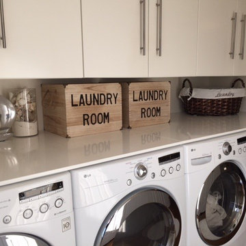 Super efficient 2 Washer and Dryer Laundry Room.